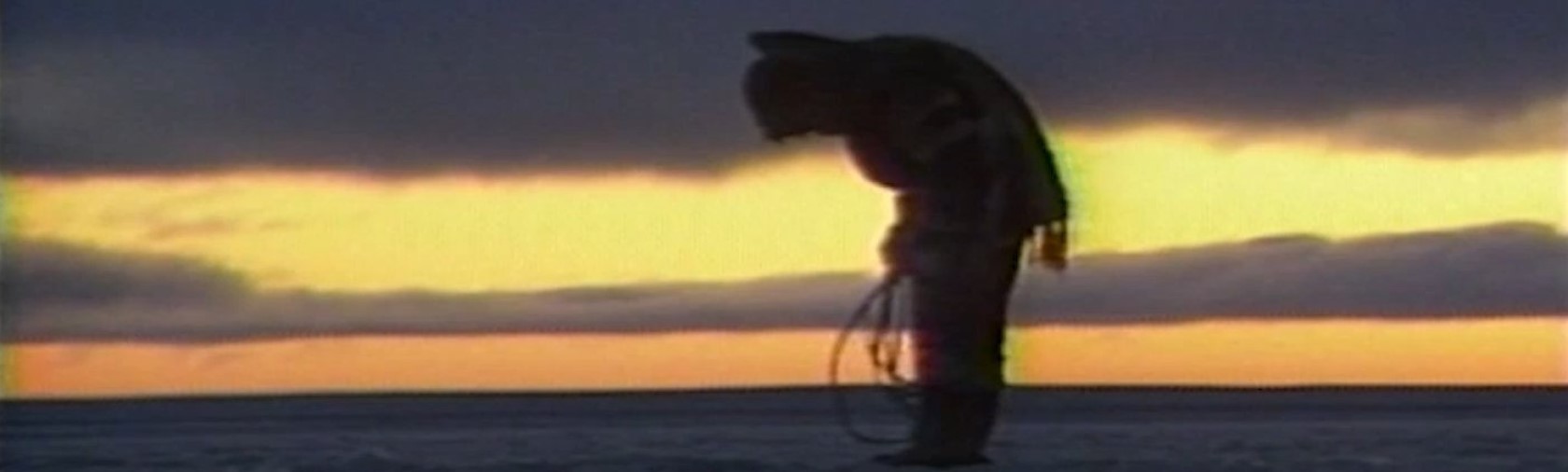 Silhouette of Inuit person at sunset