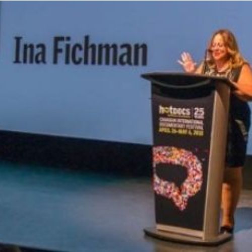 Ina Fichman accepting award on-stage