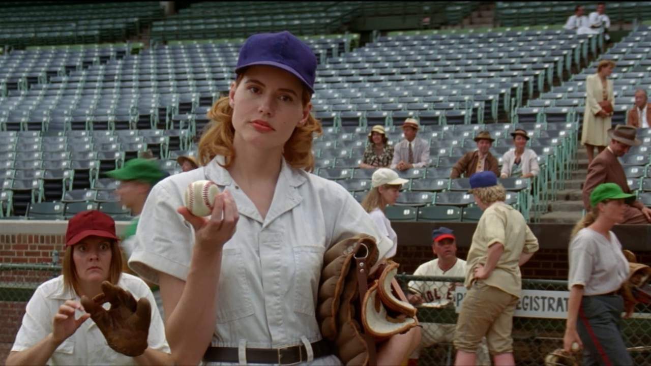 a woman holding a baseball