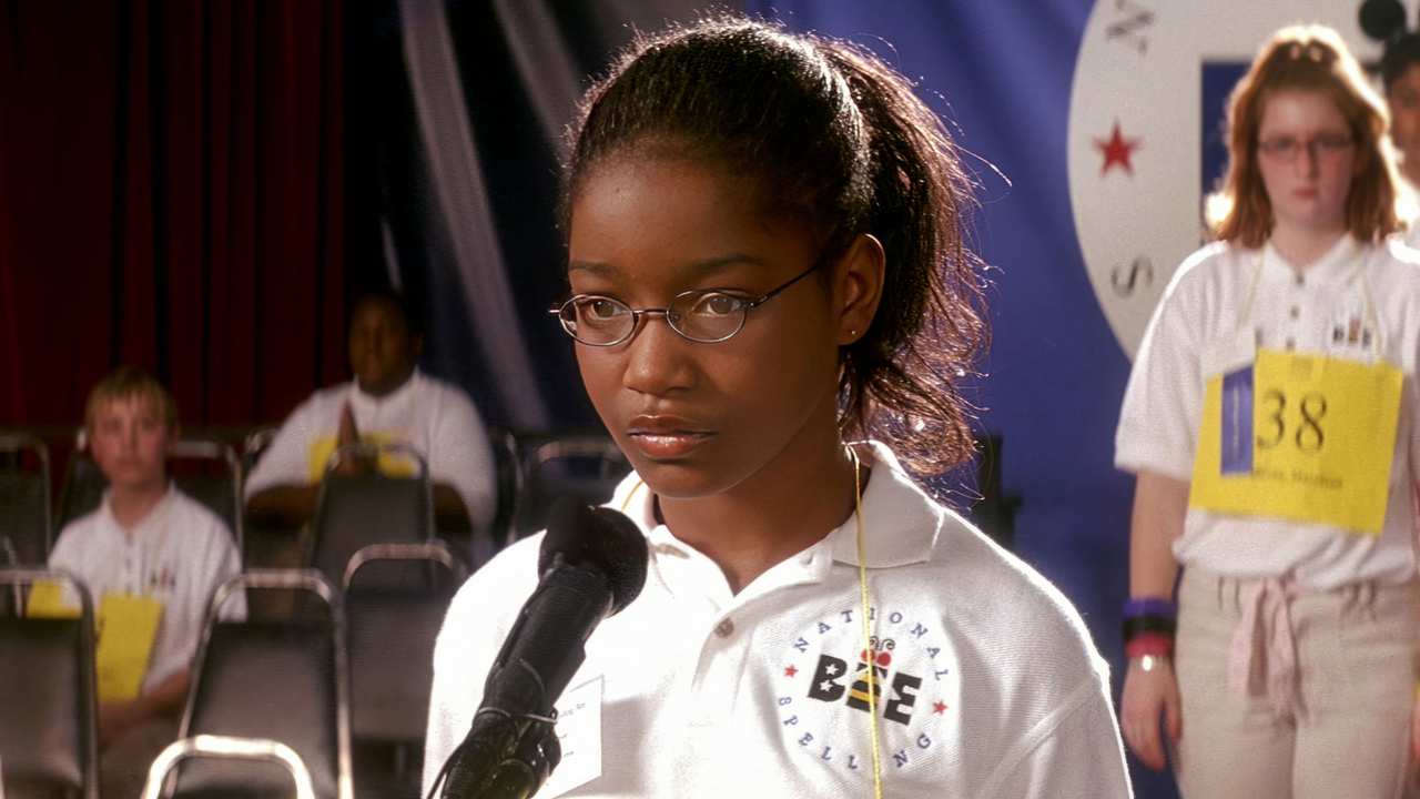 a young girl with glasses at a Spelling Bee