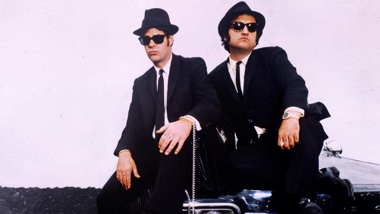 Dan Aykroyd and John Belushi in suits and fedoras