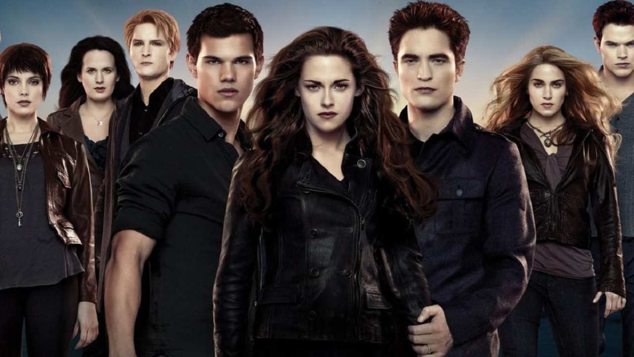 a group of vampires, a werewolf and a woman standing together