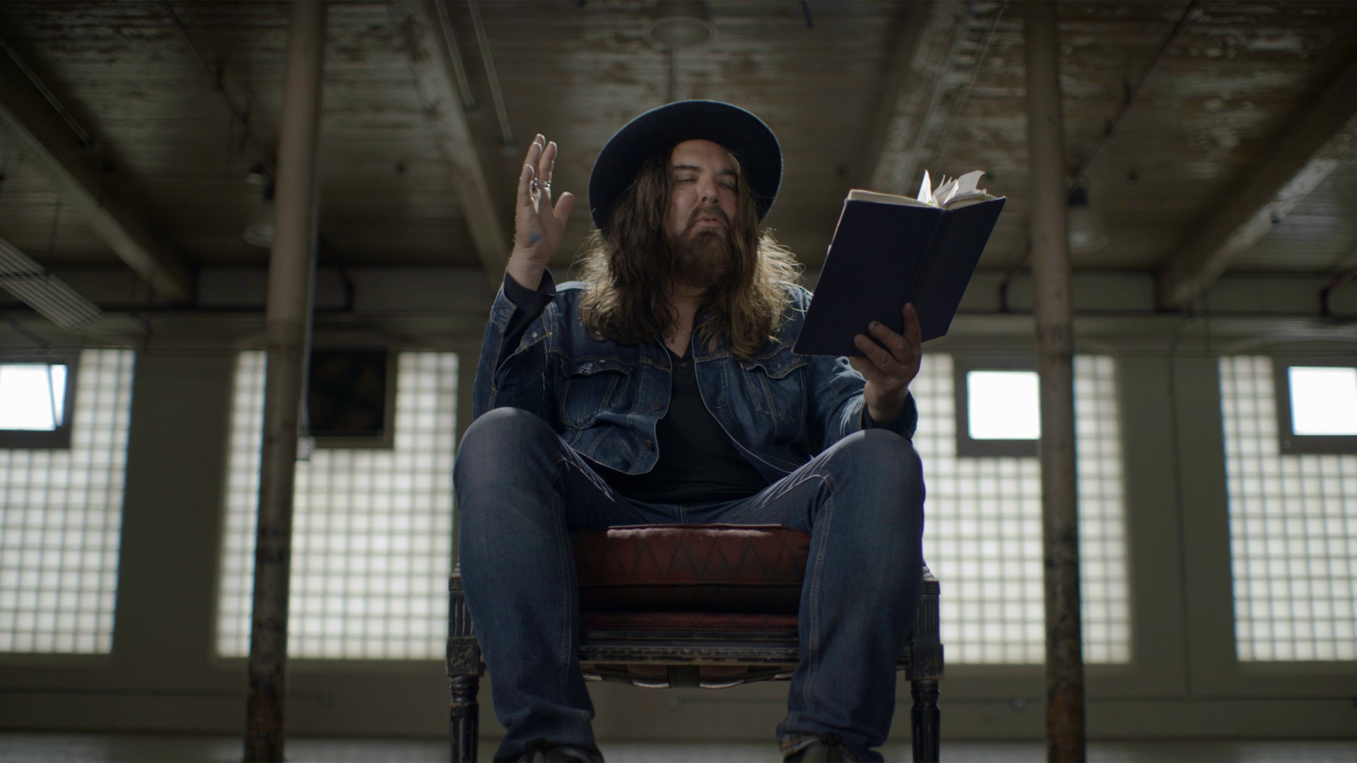 a man reading from abook