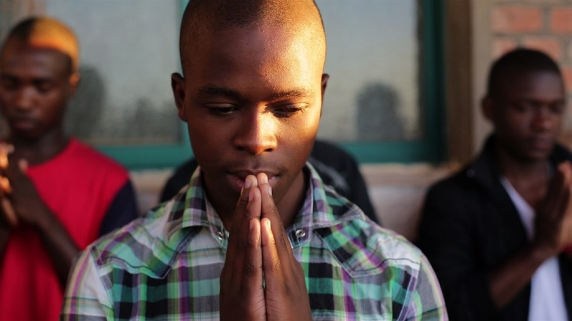 Young men praying
