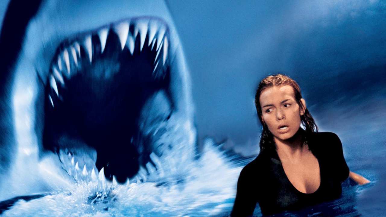 a woman fleeing from a shark