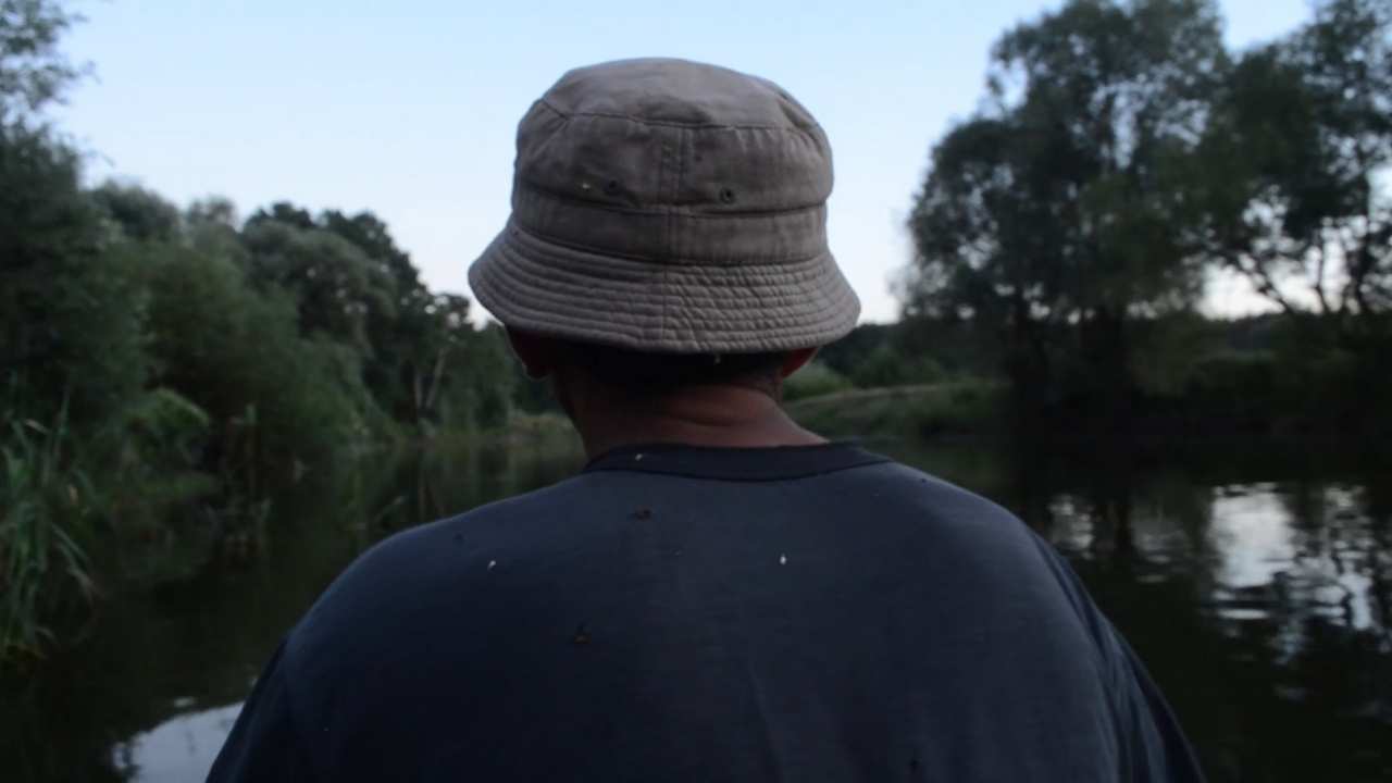 the back of a person in a hat