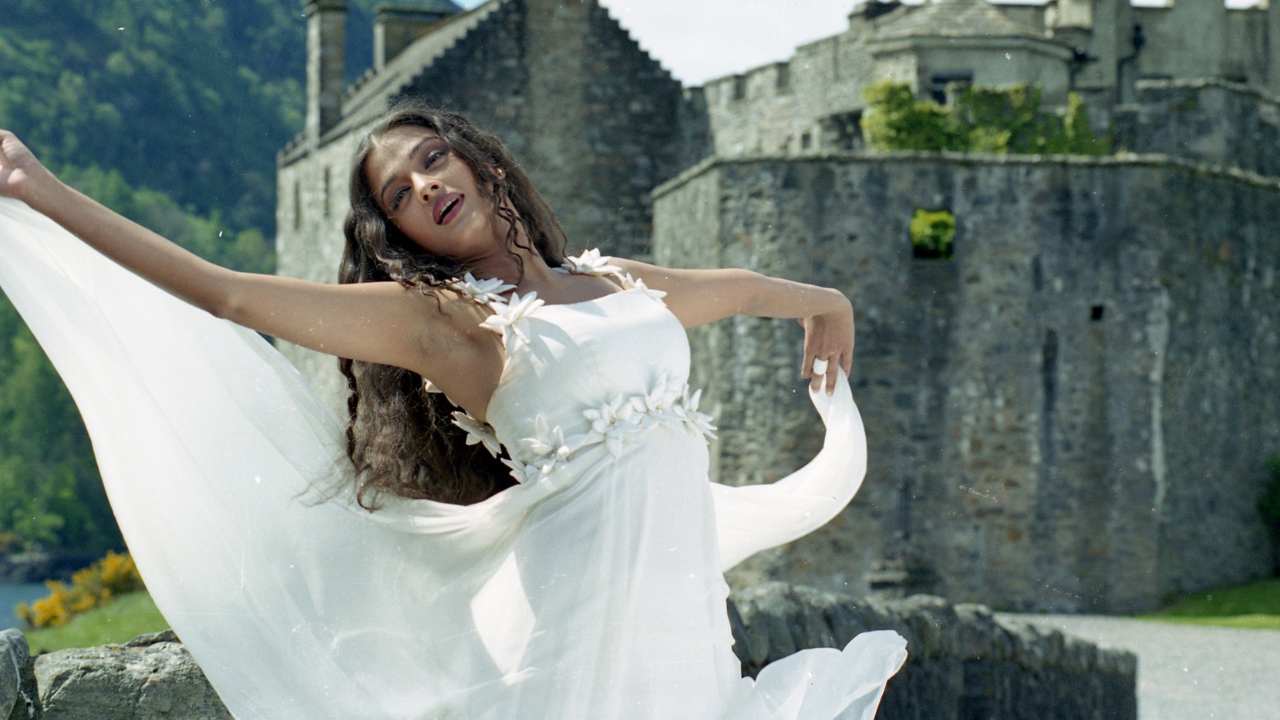 a woman in a white dress dancing