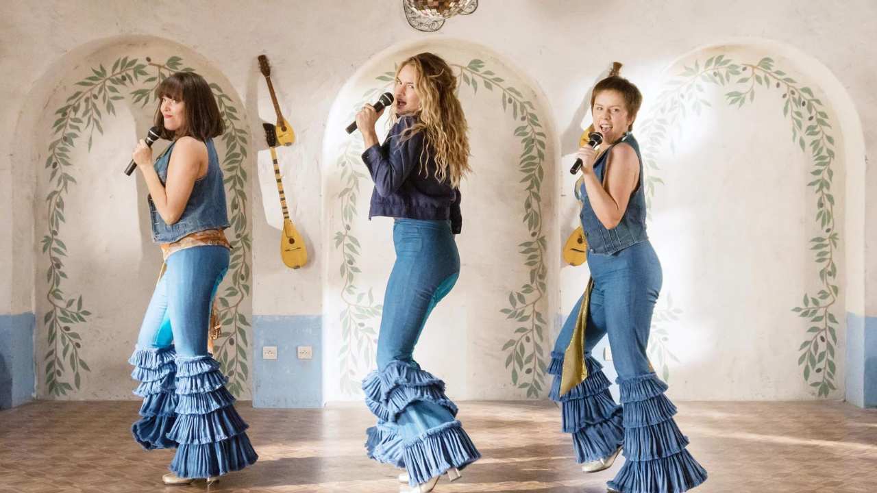 three women singing and dancing