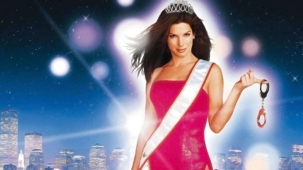 a woman with a tiara and a sash