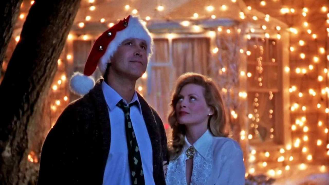 a man with a Santa hat standing next to a woman