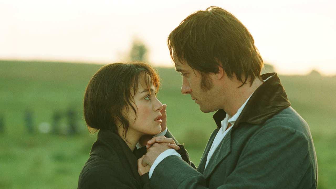 a woman and man looking at each other romantically