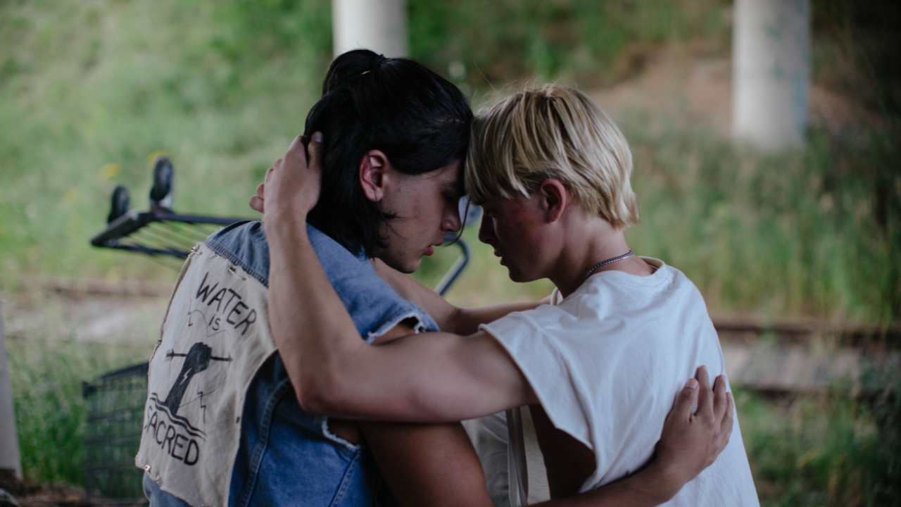 two young people embracing each other