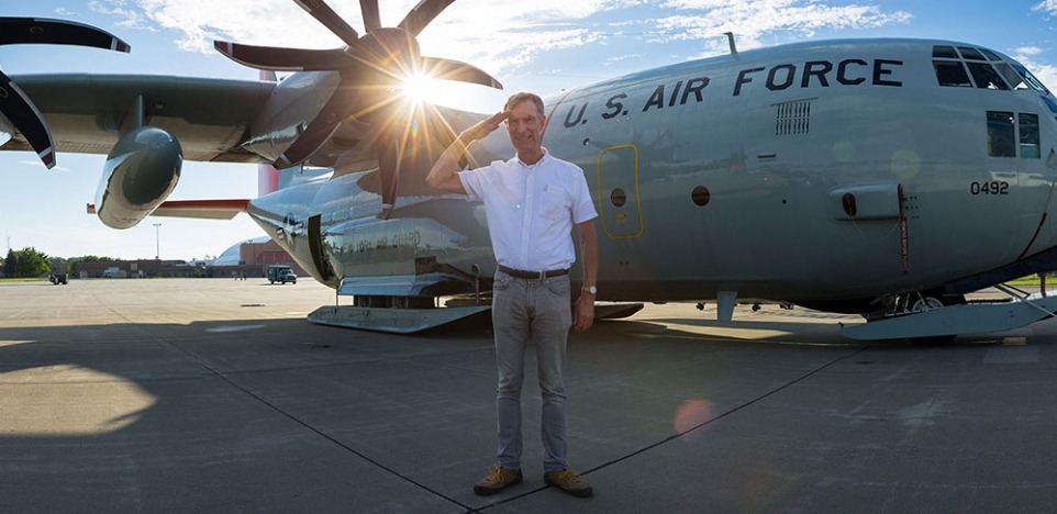 Bill Nye in front of a plane