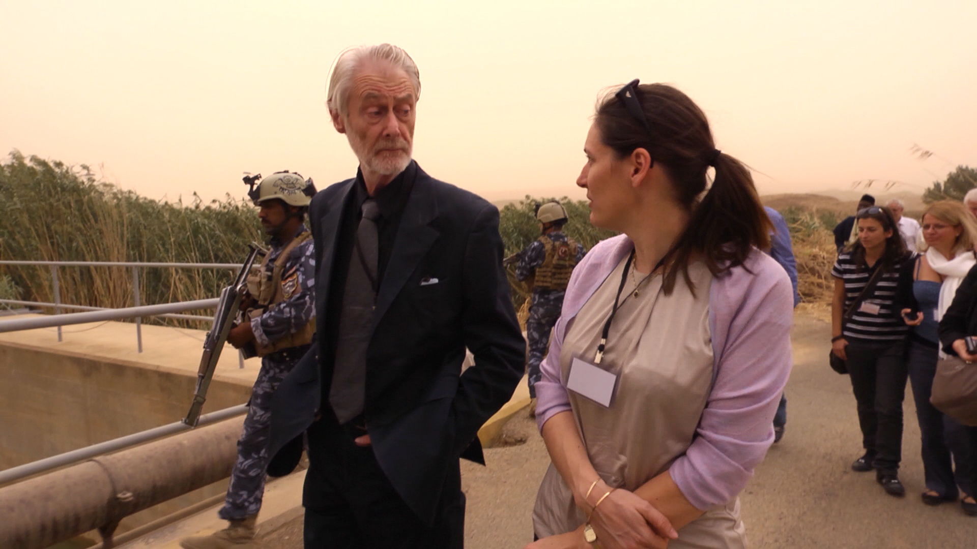 Padraig walking with armed men