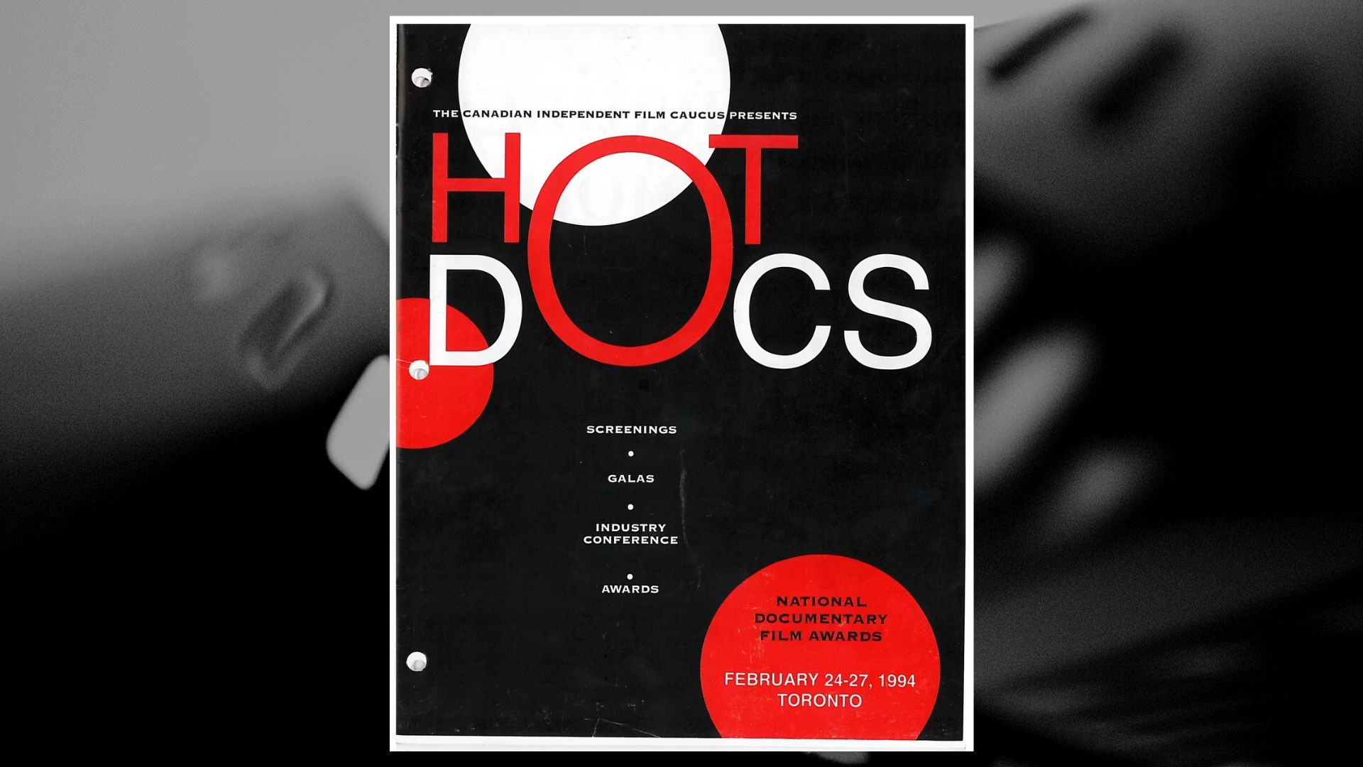 Hot Docs 1994 poster overlaying a black and white film roll image
