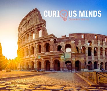 Curious Minds logo over Coliseum